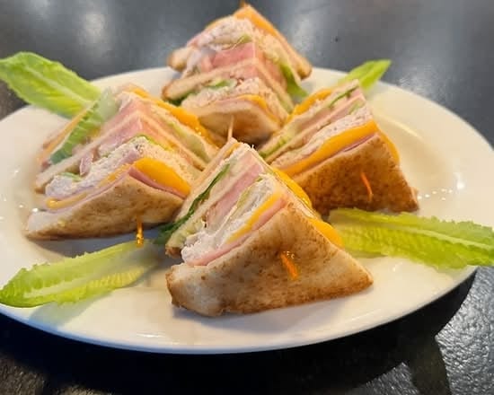 Turkey Club Sandwich with Fries.